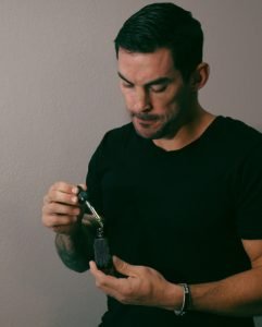 Pine needle essential oil being prepared for hair